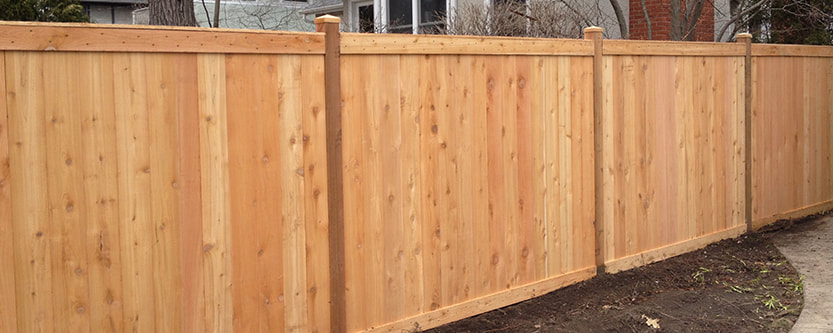 Wooden fence installation after a bad storm. This photo was taken in Mesquite, TX.